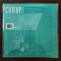 12x12 Teal Double-Sided Self-Healing Cutting Mat - American Crafts Cutup - Image 1