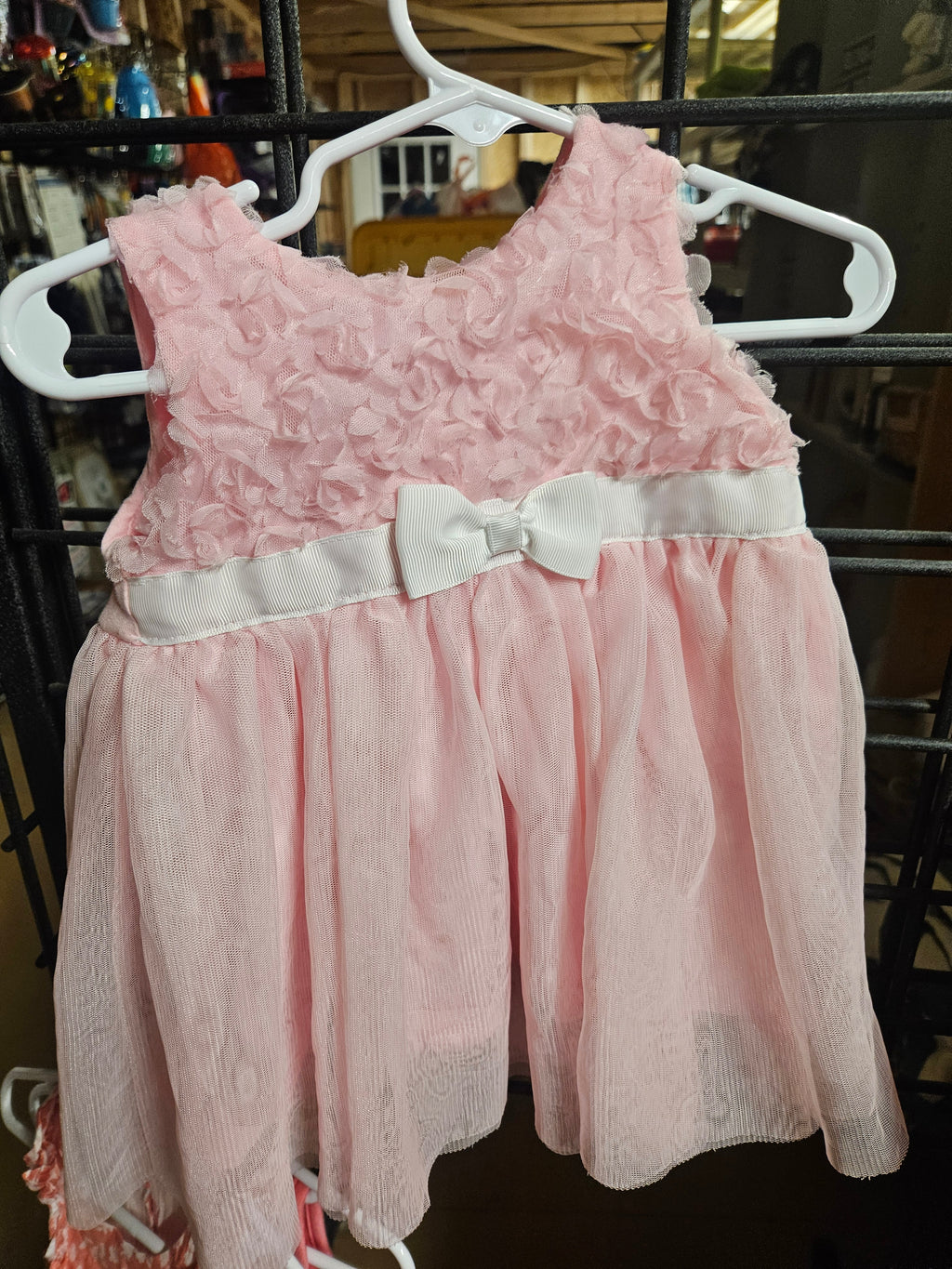 Pink Sleeveless Baby Dress with Bow Detail - Image 1