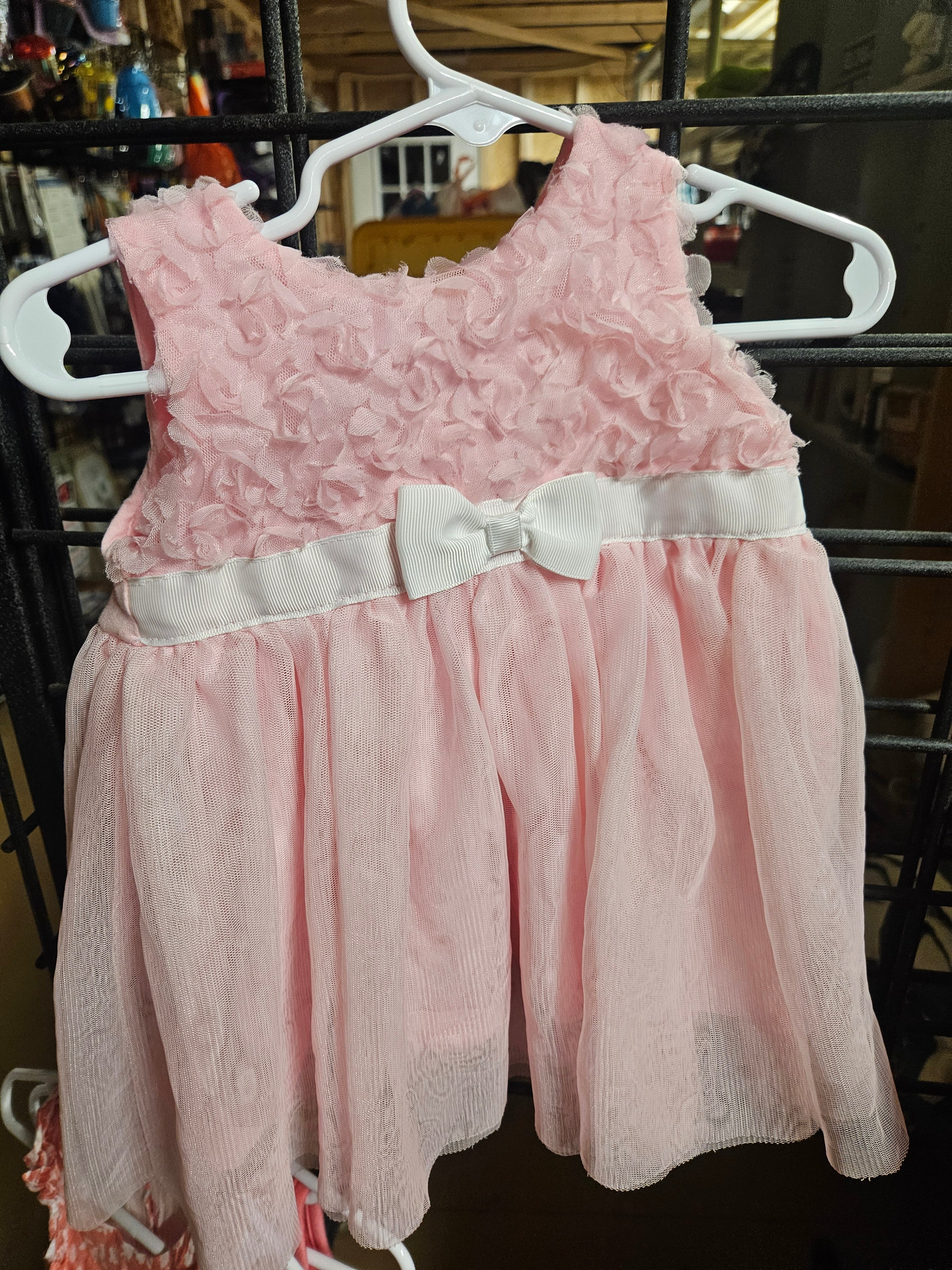 Pink Sleeveless Baby Dress with Bow Detail - Image 1