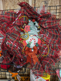 Festive Christmas Wreath with Glitter Bow and Candy Cane Accents - Image 1