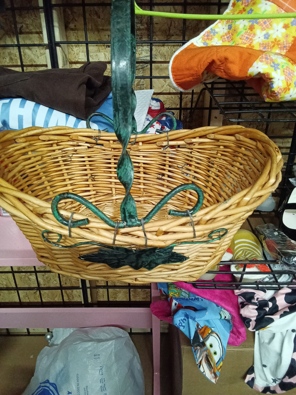 Wicker Basket with Green Metal Handle and Leaf Design - Image 2