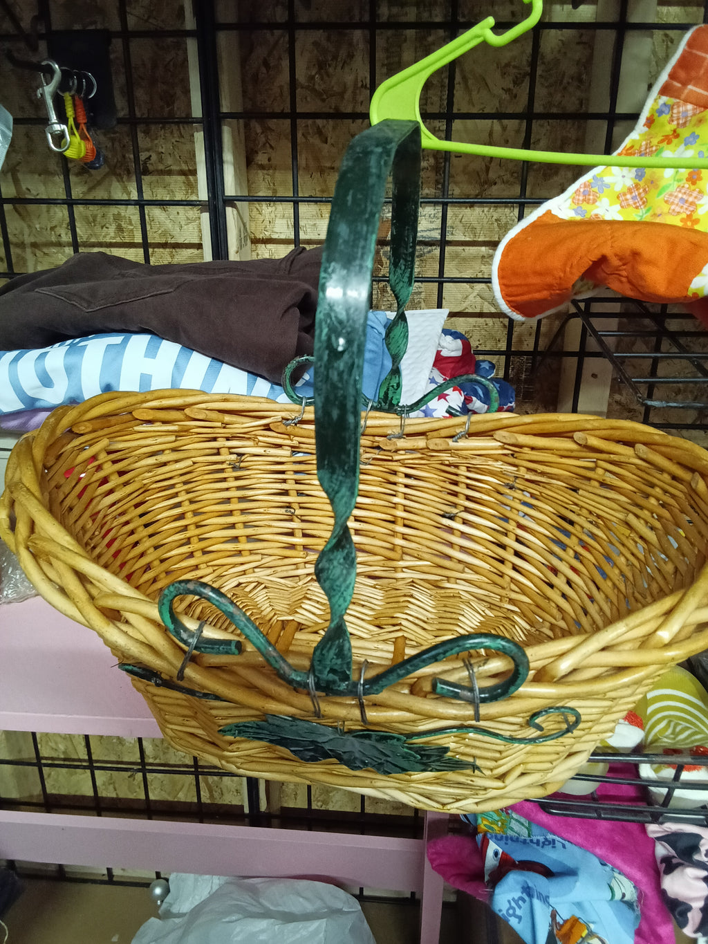 Wicker Basket with Green Metal Handle and Leaf Design - Image 3