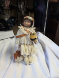 Native American Style Porcelain Doll with Drum - Image 1